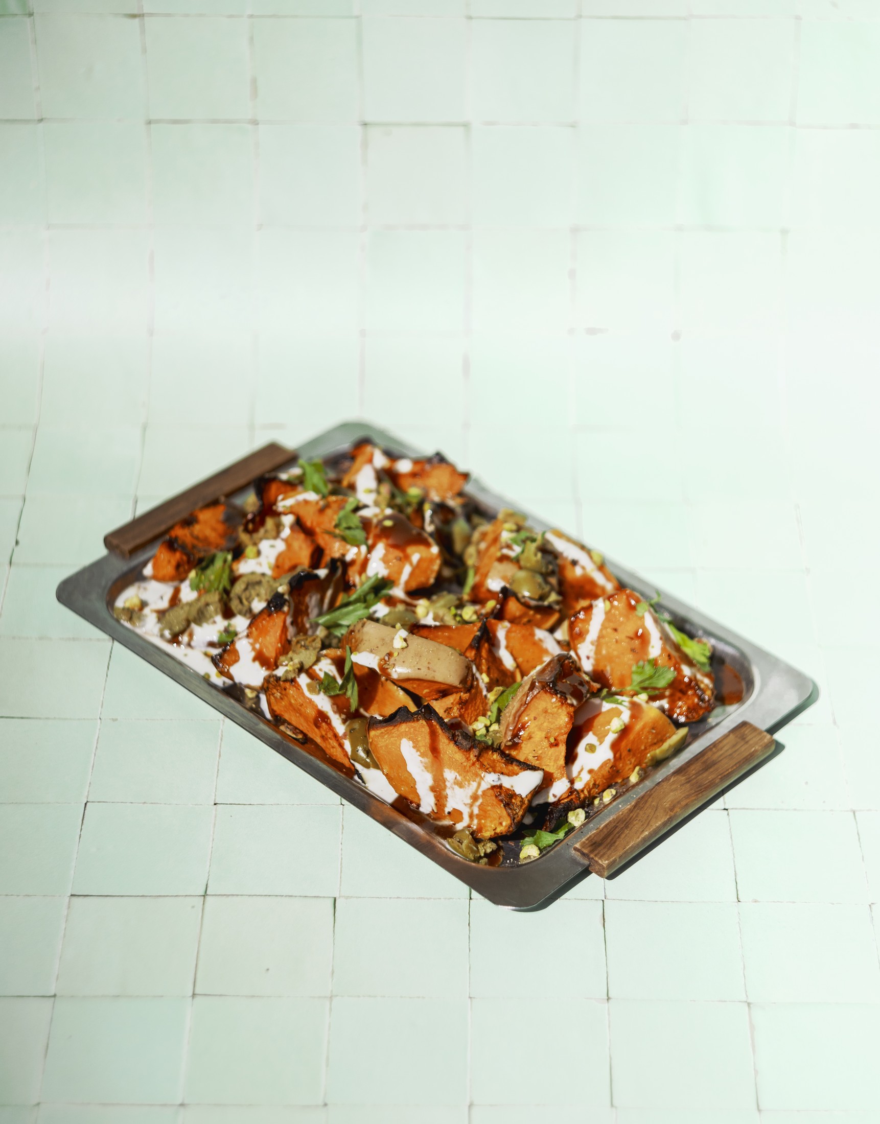 Overhead shot of a tray of roasted pumpkin and root vegetables