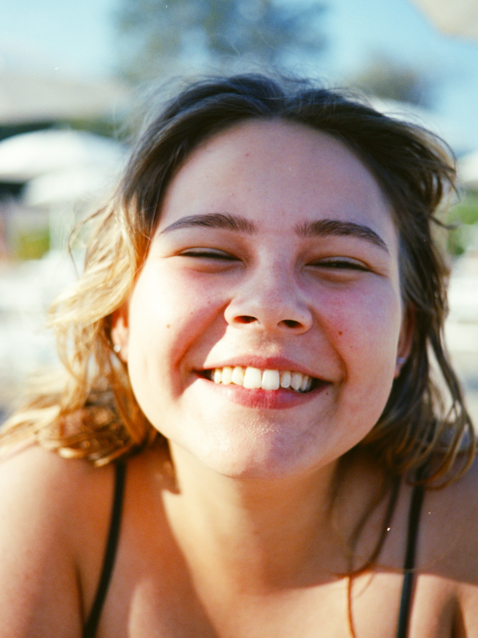 Candid portrait of a young woman laughing
