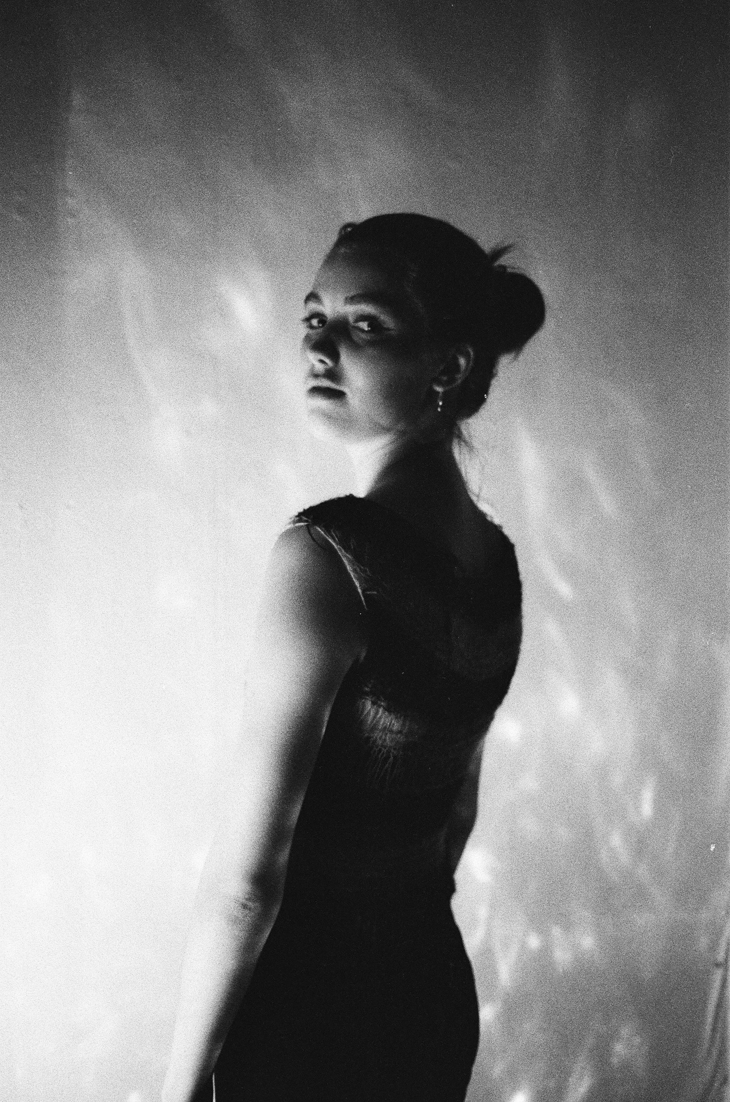 Dramatic black-and-white silhouette portrait in profile